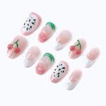 Press-on nails from the right side, highlighting the 3D cherry and strawberry design