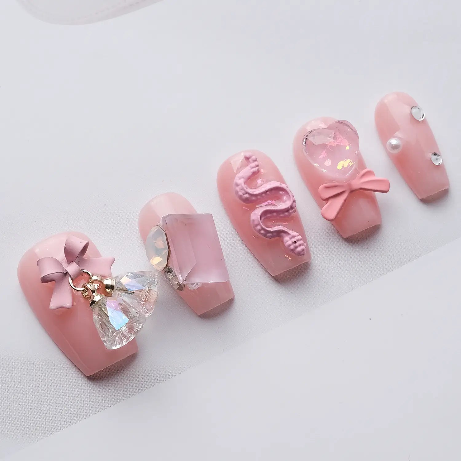 Press-on nails from a side view, showing the exquisite 3D nail design.