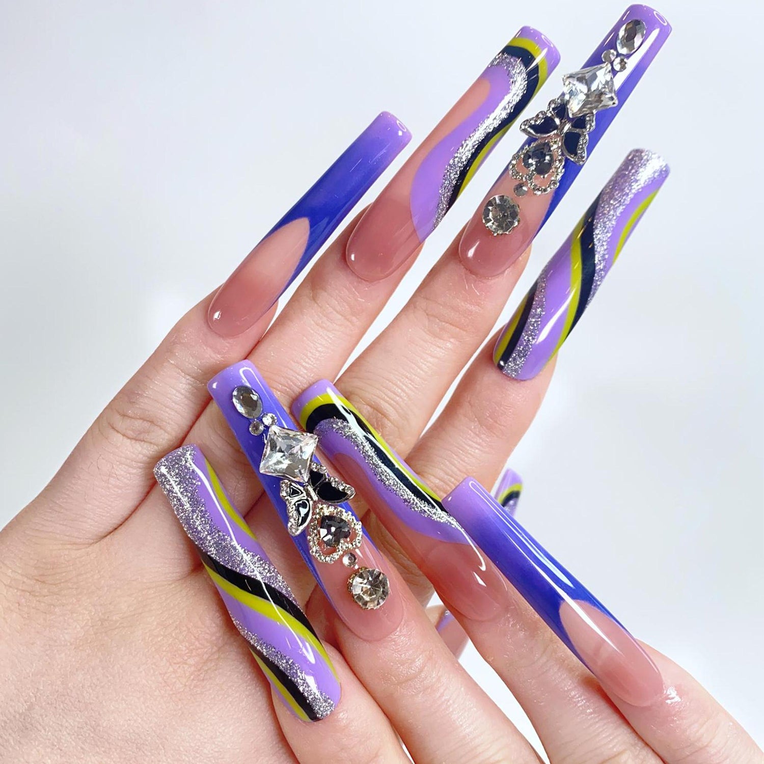 Purple Wave and Diamond Butterfly Long Square Press-On Nails on a model