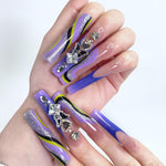 Detail of the Purple Wave and Diamond Butterfly Long Square Press-On Nails on a model