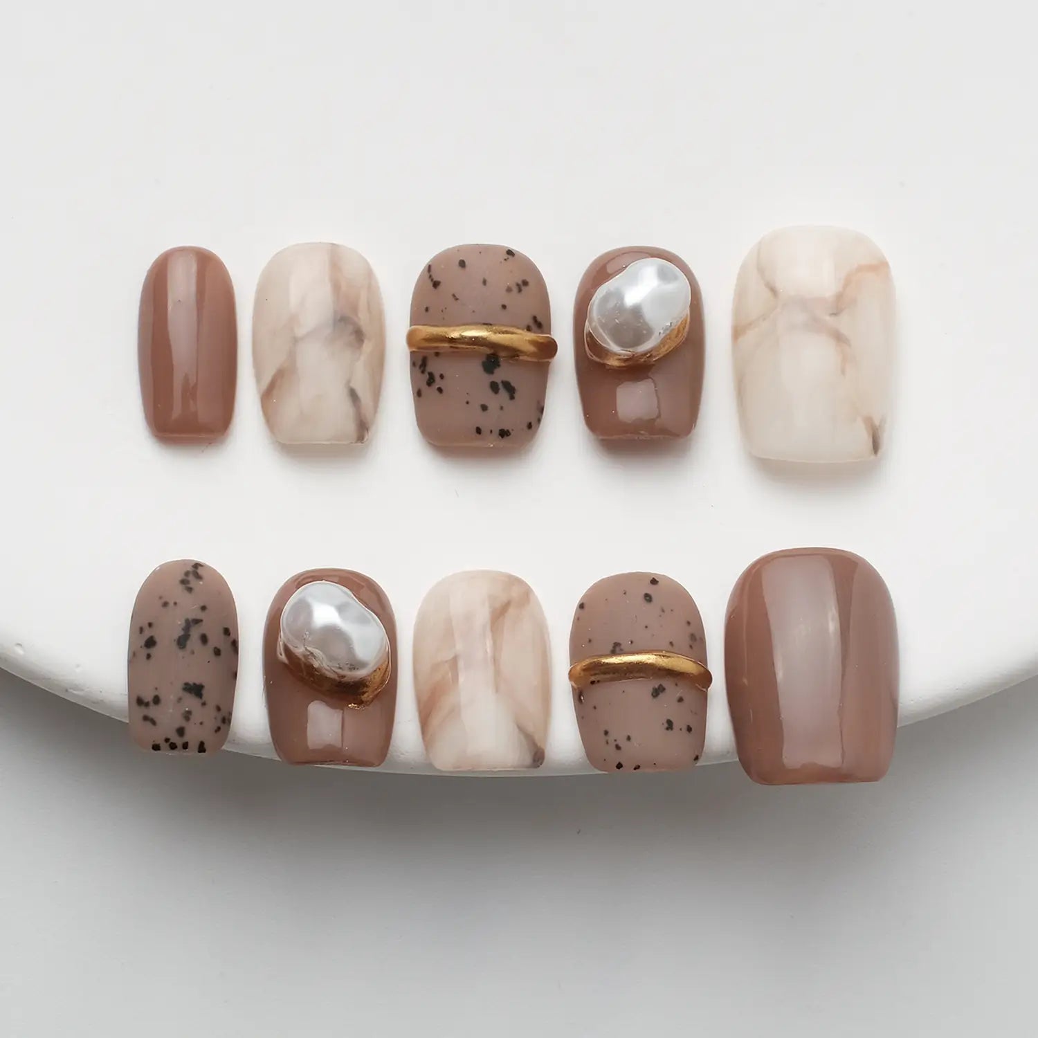 Brown acrylic nails with pearl marble texture