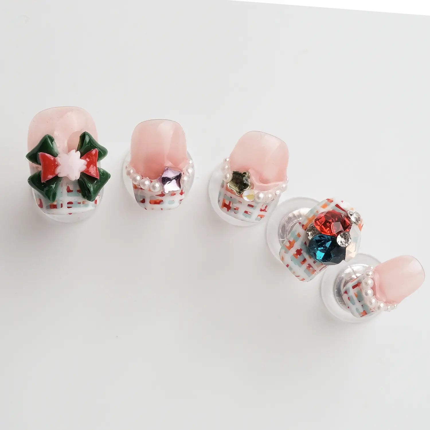 Cute christmas style acrylic nails with bows