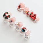Soft Nude Pink Christmas Nails with Heart Rhinestones and Pearls