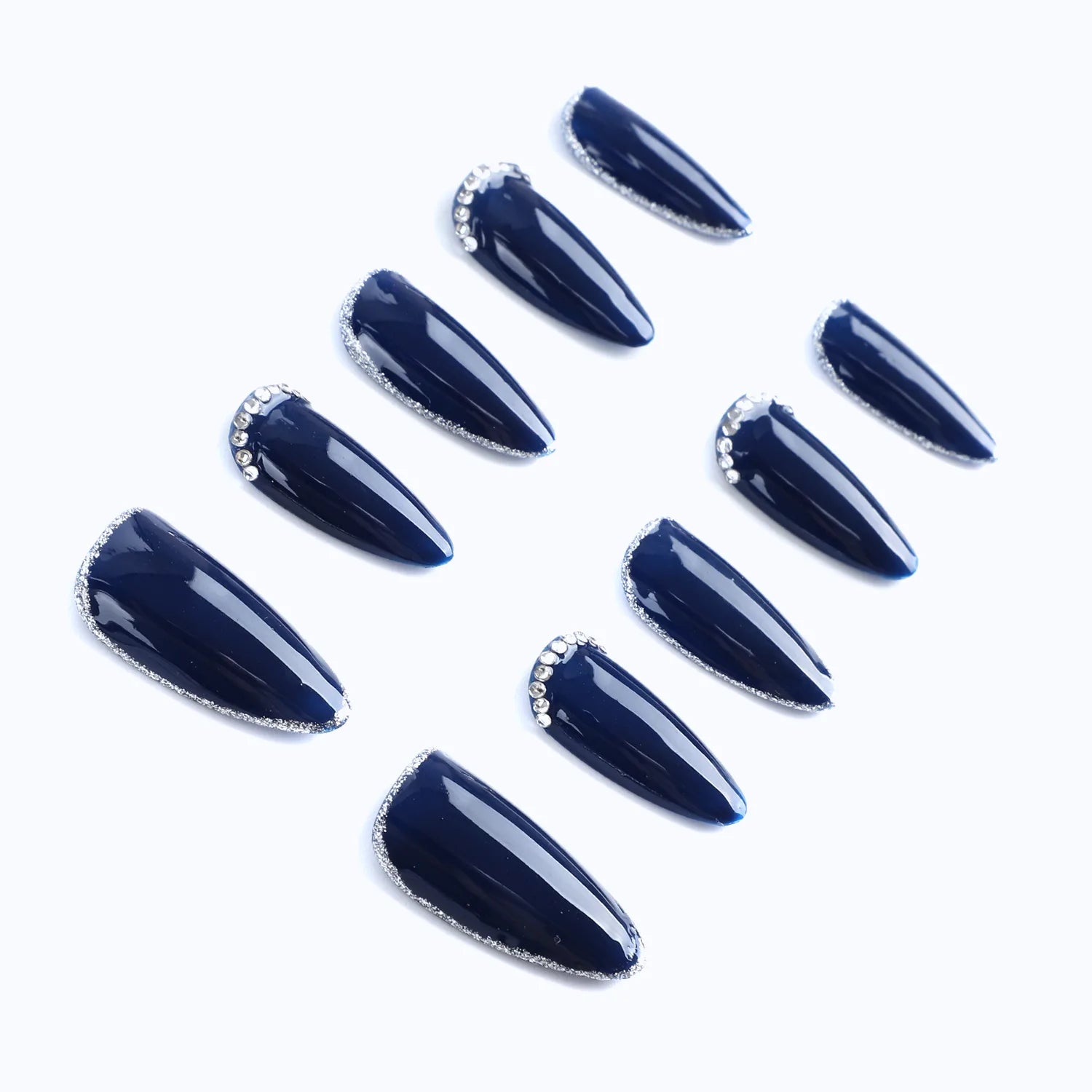 Press-on nails from a side view, showing the clear nail shape and 3D delicate design.
