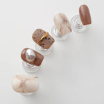 High end light luxury style brown and beige nails with pearls