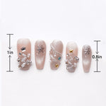 Length of sparkling pink fake nails with pearl and rhinestones