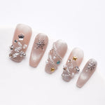 Sparkling pink fake nails with pearl and rhinestones